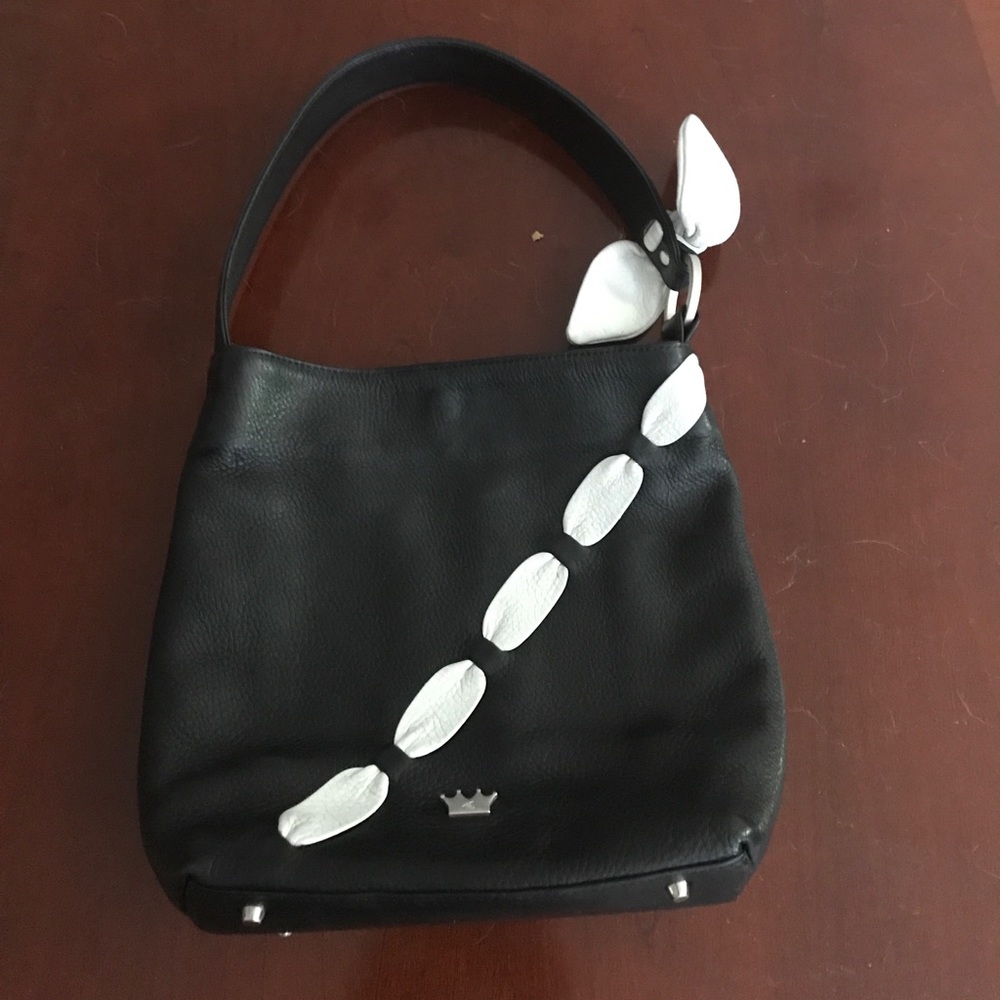 Soft black leather handbag with ivory bow accents